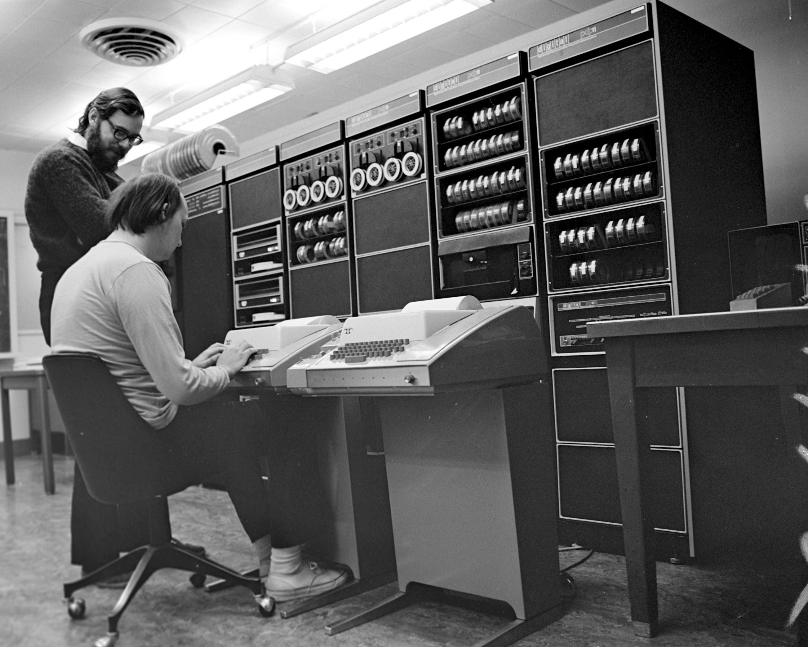 Ken Thompson (sitting) and Dennis Ritchie on a PDP-11